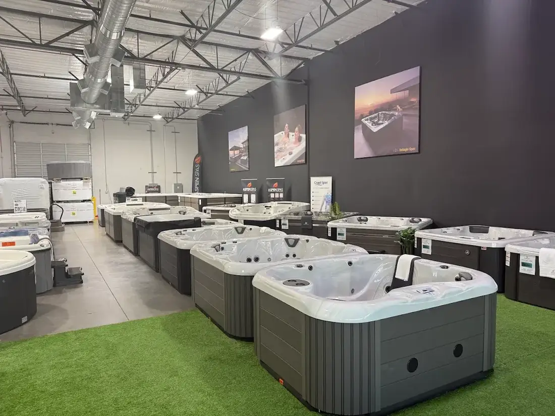Used and new hot tubs lined up on the DS Outdoor Living showroom floor