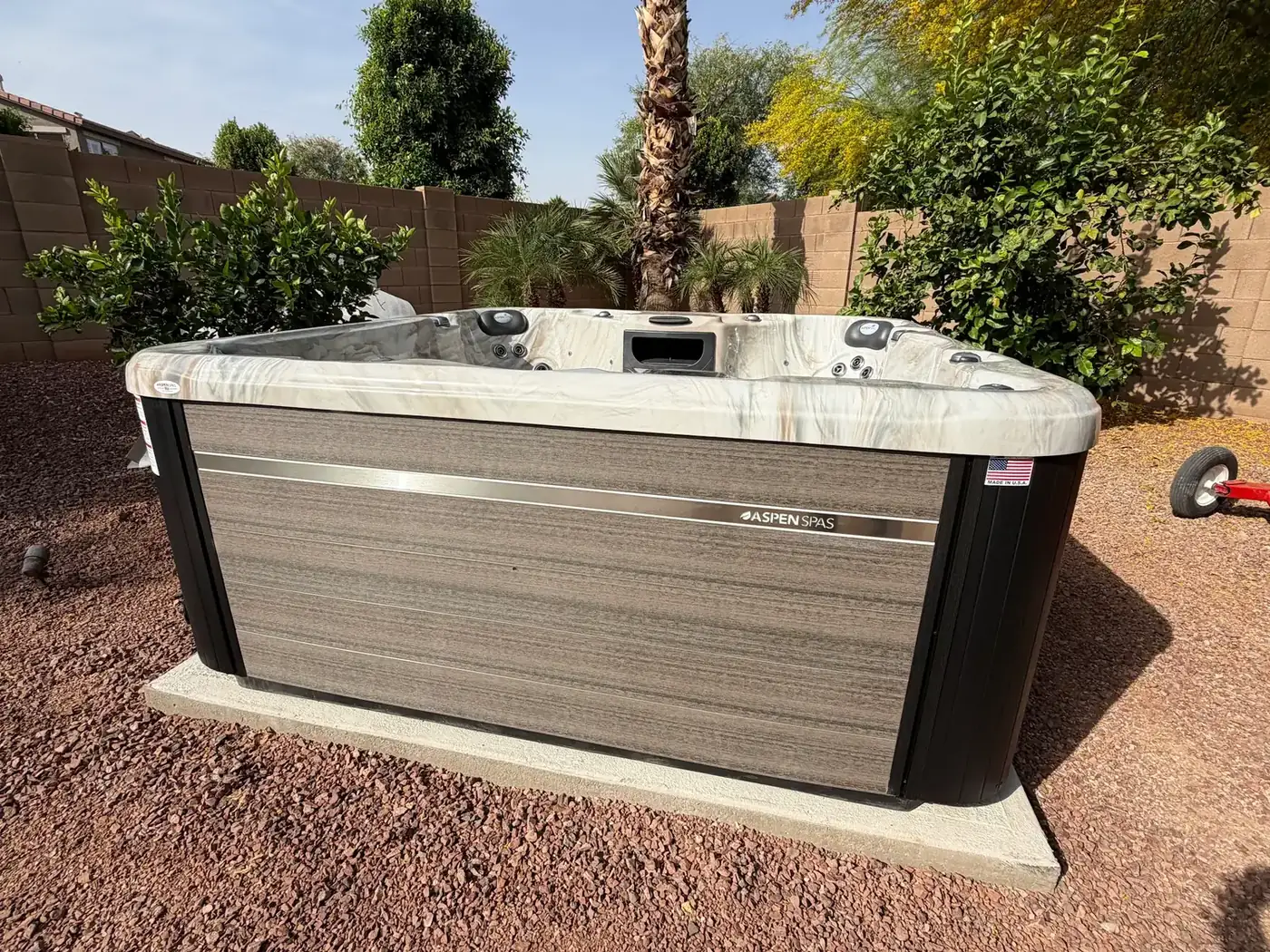 Hot tub installed on a concrete pad in an Arizona backyard